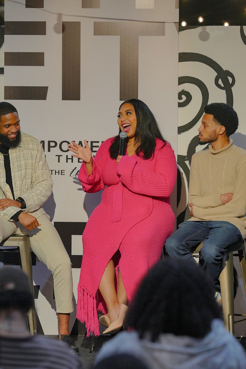 Alexis moderating a live panel